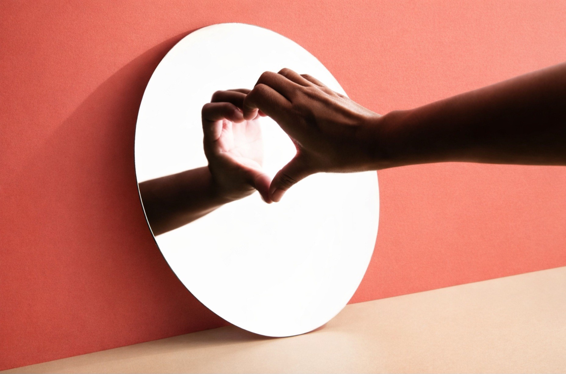 EMDR therapy for confidence and self-esteem in London – hands forming heart reflection symbolising self-worth, healing and emotional resilience